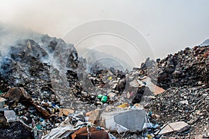 Garbage dump mountains view full of litter, plastic bottles,rubbish and other trash at the Thilafushi tropical island