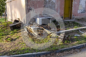 Garbage dump near an abandoned house photo