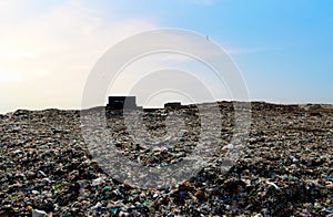 Garbage dump with plastic bags and food waste. Recycling of waste on junk yard. Dispose the rubbish in landfill.