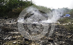 Garbage Dumping and burning site creating air pollution by smoke, pollution control day, land pollution, Raipur, india