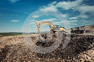 Garbage dumpsite - excavation works with heavy duty machinery