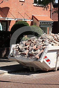 Garbage Dumpster near a construction site