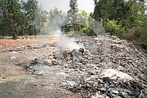 Garbage, fire burning in landfill, effects to environmental