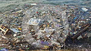 Garbage floating on the coast. Environmental pollution Rubbish plastic bottles, bags, trash floating in the water. Concept of sea