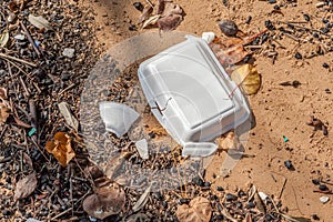 Garbage and foam litter on beach, beach pollution environment.