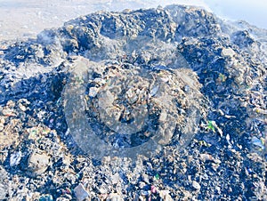 Garbage heap burnt waste pile on fire trash smoke rubbish burning ashes air pollution dump litter  image photo photo