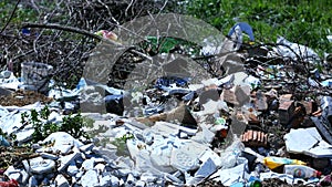 Garbage on hill near forest