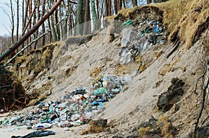 Garbage left by man in the forest, plastic waste glass bottles in nature