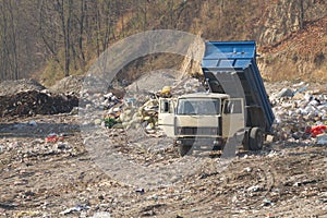 Garbage machines unload garbage photo