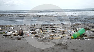 Garbage on the ocean. Beach polluted with plastic bottles