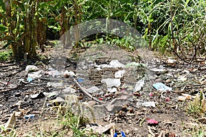 Garbage in the park spilled garbage on ground of the big city used dirty plastic bottles dirty environmental pollution ecological