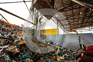 Garbage pile getting sorted for recycling of materials