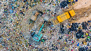 Garbage pile in trash dump or landfill, Aerial view garbage trucks unload garbage to a landfill, global warming