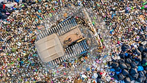 Garbage pile in trash dump or landfill, Aerial view garbage trucks unload garbage to a landfill, global warming