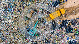 Garbage pile in trash dump or landfill, Aerial view garbage trucks unload garbage to a landfill, global warming photo