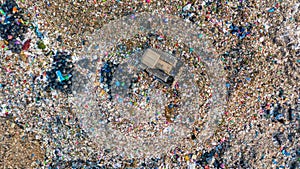 Garbage pile in trash dump or landfill, Aerial view garbage trucks unload garbage to a landfill, global warming photo