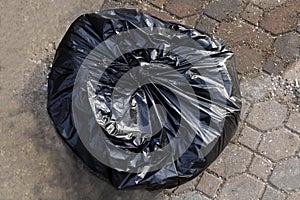 Garbage plastic bag black on the cement floor, bag plastic of garbage waste, plastic bag for waste separation recycle, garbage