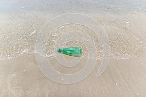 Garbage and plastic bottles and dirty waste on a beach Asia Thailand.