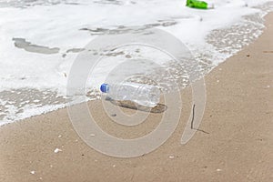 Garbage and plastic bottles and dirty waste on a beach, Concept Campaign to stop using