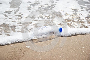 Garbage and plastic bottles and dirty waste on a beach, Concept Campaign to stop using