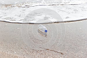 Garbage and plastic bottles and dirty waste on a beach, Concept Campaign to stop using