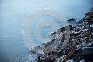 Garbage, plastic, wood,shell and wheel on the beach