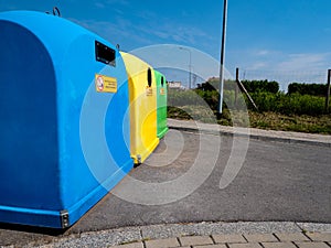 Garbage recycling concept, colorful plastic garbage containers on the street of the city with place for text.