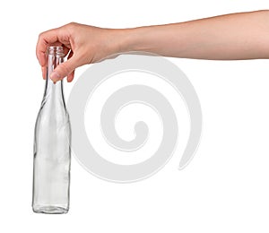 Garbage recycling concept. Female hand holding empty glass drink bottle isolated on white