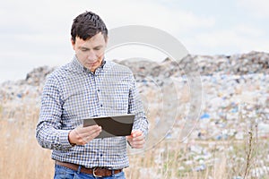 Garbage recycling concept. man on dumpster. Keeping the environment clean. Ecological problems