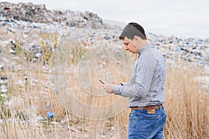 Garbage recycling concept. man on dumpster. Keeping the environment clean. Ecological problems