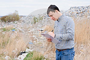 Garbage recycling concept. man on dumpster. Keeping the environment clean. Ecological problems