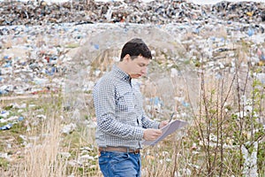 Garbage recycling concept. man on dumpster. Keeping the environment clean. Ecological problems