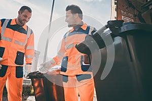 Garbage removal men working for a public utility