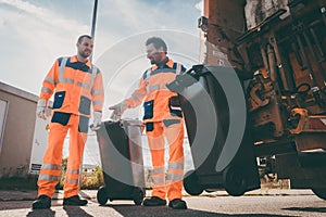 Garbage removal men working for a public utility