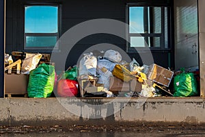 Garbage removal - overflowing plastic waste bags, Pile of junk