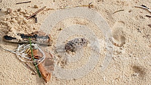 Garbage on sand beach