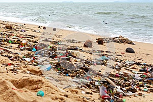 Garbage on sea beach, dirty ocean water, environmental pollution, ecology, waste, rubbish, plastic, trash, refuse, litter