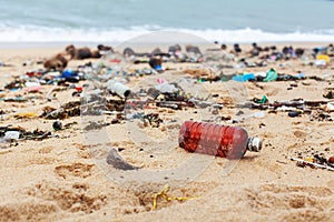 Garbage on sea beach, dirty ocean water, environmental pollution, ecology, waste, rubbish, plastic, trash, refuse, litter