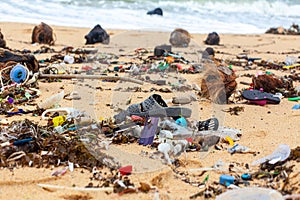 Garbage on sea beach, dirty ocean water, environmental pollution, ecology, waste, rubbish, plastic, trash, refuse, litter