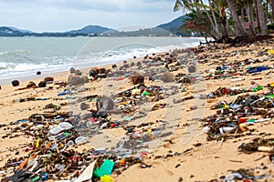 Garbage on sea beach, dirty ocean water, environmental pollution, ecology, waste, rubbish, plastic, trash, refuse, litter