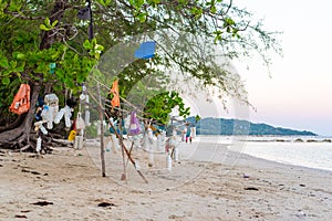 Garbage from the sea hanging on tree branches