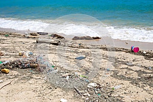 Garbage on the seashore. Dirty beach, environmental problem