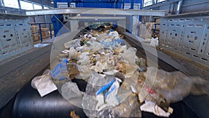 Garbage sorting conveyor on a waste recycling plant.