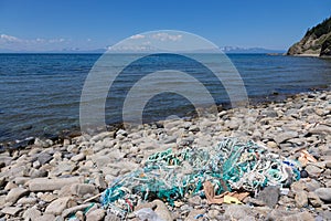 Garbage thrown on the sea shore. Cape Stolbchaty. Cape on the we