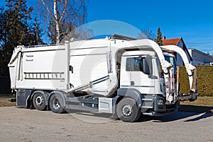 Garbage truck with front loader