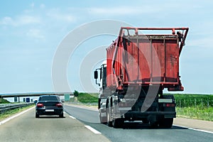 Garbage truck on a highway or motorway photo