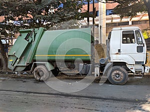 Garbage truck standing on a road