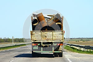 Garbage on truck, Transport accident, unsafe transportation of metal concept.