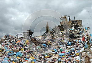 Garbage truck unloading at the dump