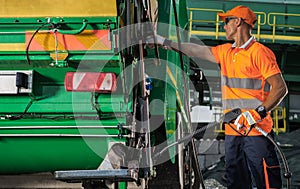 Garbage Truck Worker with Pressure Washer Lance in His Hands